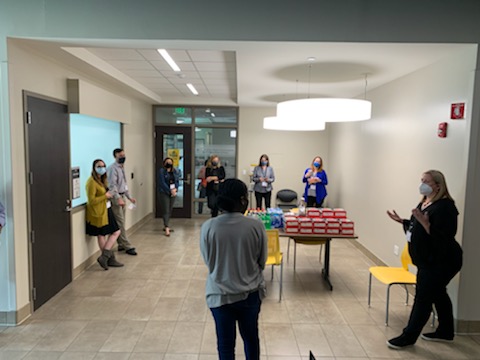 Staff from USF and UCF share during a Emotional Intelligence training exercise in a hallway at a UCF educational building.