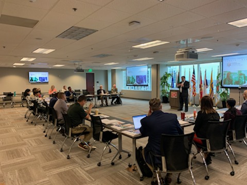 Meeting room with people from Orlando cybersecurity industry leaders and higher education professionals at UCF. 