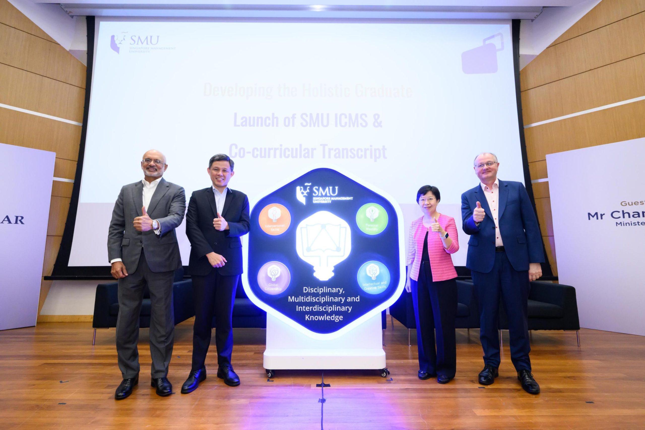 anel giving thumbs up in Singapore at the launch of Singapore Management University, ICMS & Co-Curricular Transcript